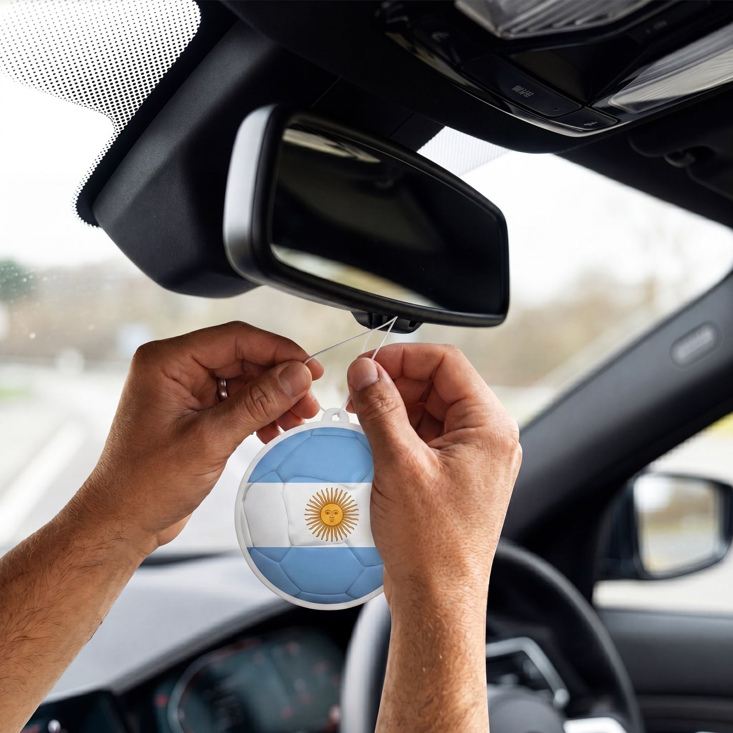 Argentina flag car freshener hanging on rearview mirror