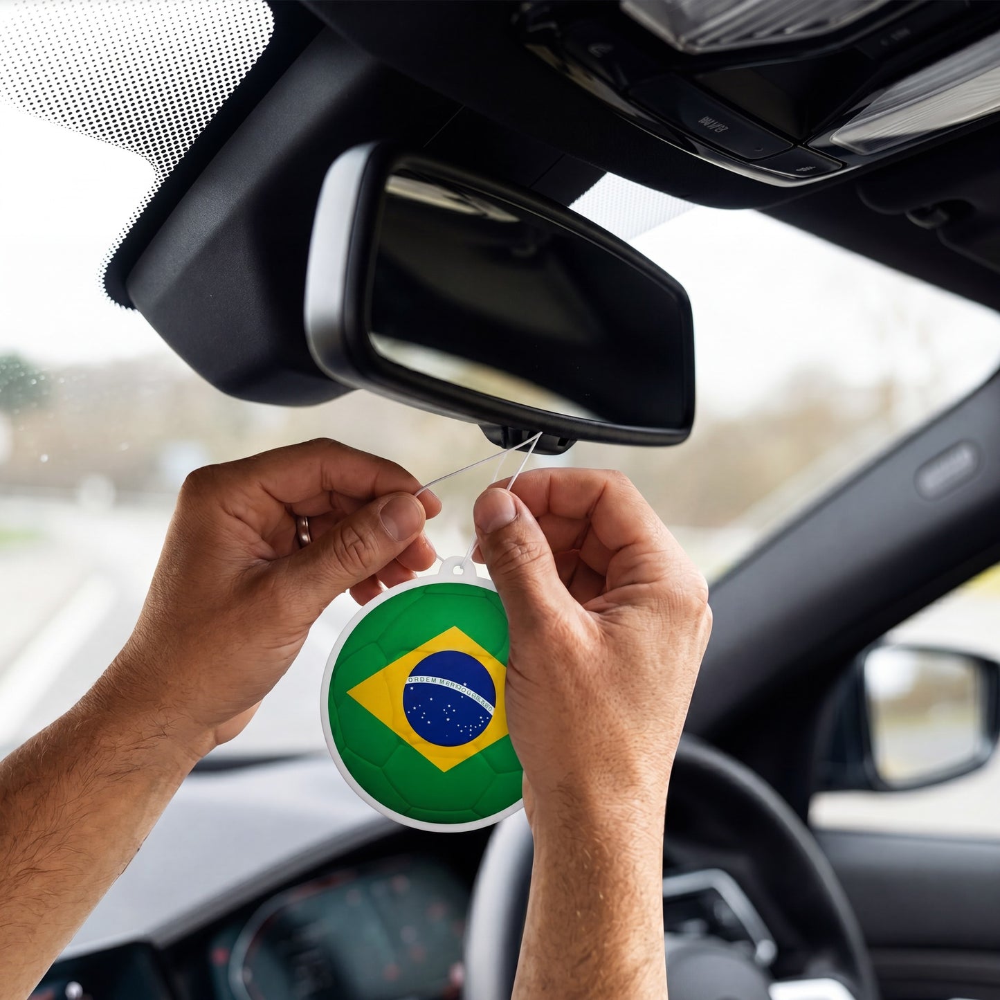 Brazil flag car freshener hanging on rearview mirror