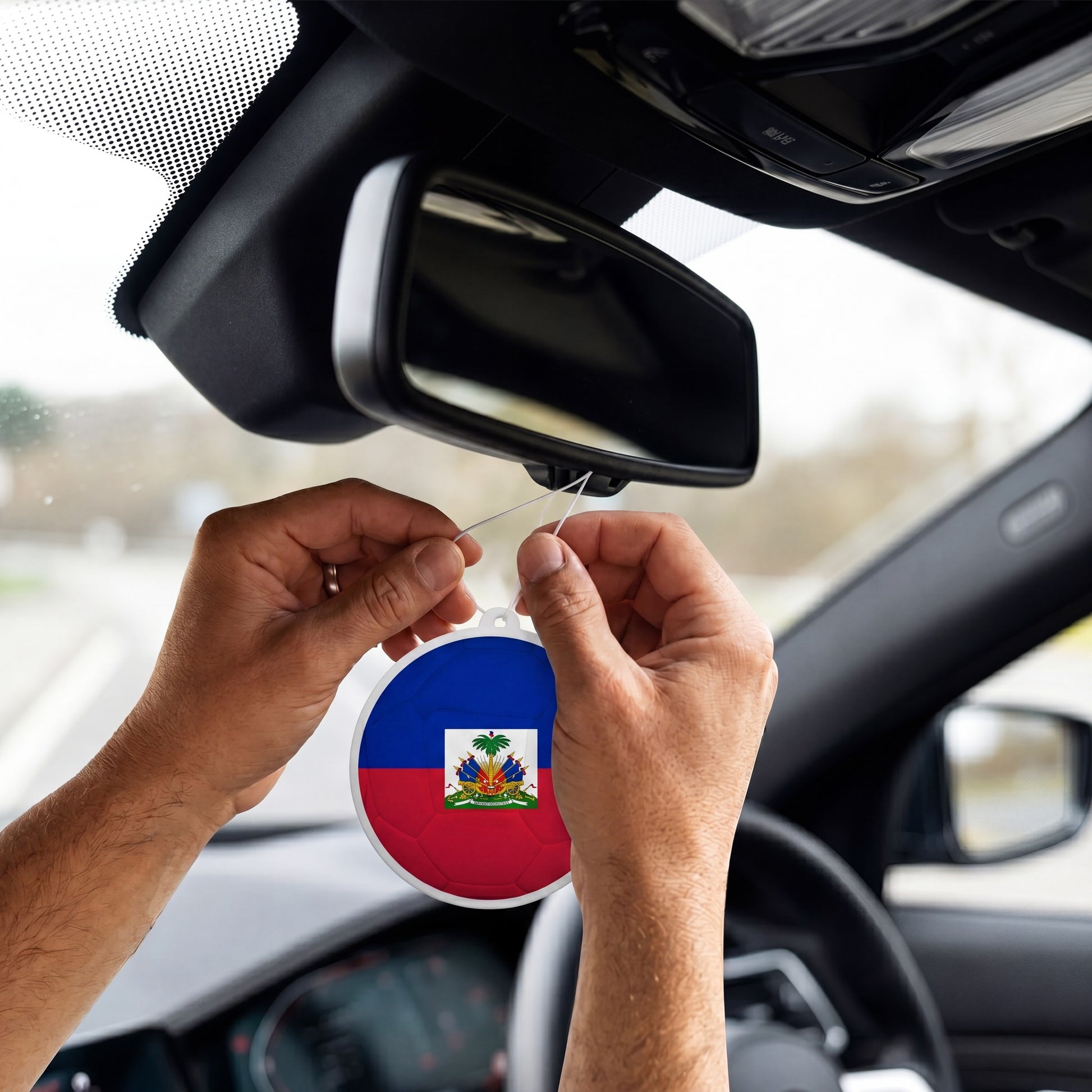 Haiti flag car freshener hanging on rearview mirror